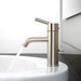 Pfister Contempra single control bathroom faucet in brushed nickel, installed on a white countertop, with water flowing into a modern sink.