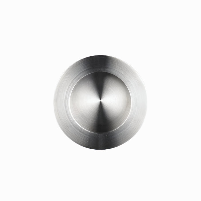 Richelieu 3402 modern recessed metal pull in brushed nickel top angle view showing circular recess and smooth profile.