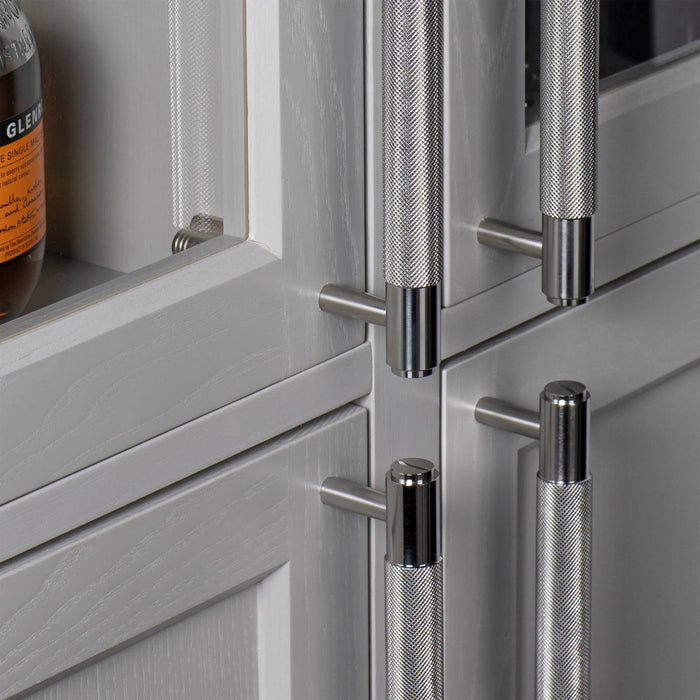 Steel Buster + Punch Double-Sided Pull Bar Cross installed on luxury cabinetry