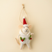 Cream mouse ornament wearing a red Santa hat and a hooded coat decorated with green holly leaves and red berries