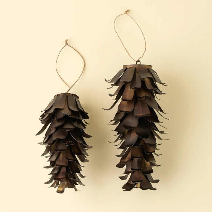 Two bronze iron pinecone ornaments in different sizes with layered metal scales and natural hanging loops