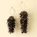 Two bronze iron pinecone ornaments in different sizes with layered metal scales and natural hanging loops