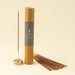 Ember incense set with a brown gift tube, bundled sticks, and one stick standing in the included holder