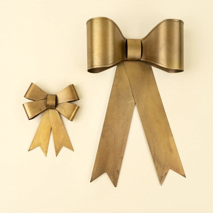 Large and small Gilded Bow ornaments displayed side by side, showing their different sizes and loop designs