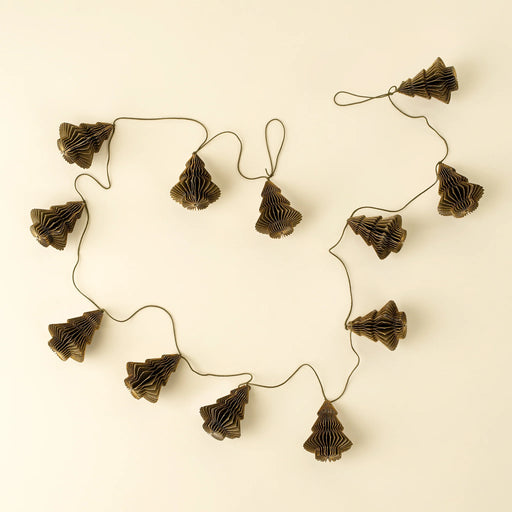 Indaba holiday garland with folded antique green paper trees spaced along a cord on a cream background