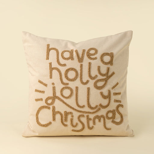 Square natural cotton pillow with raised tan lettering reading have a holly jolly Christmas