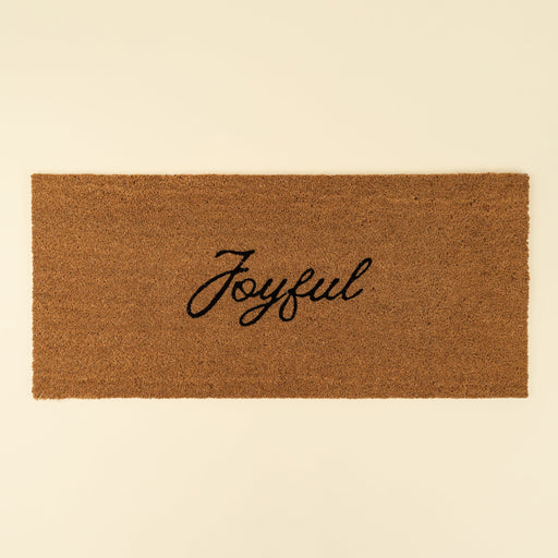 Indaba rectangular natural coir doormat with the word Joyful printed in black cursive lettering