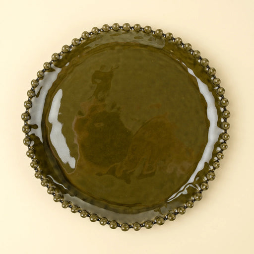 Top view of an Indaba Merida green stoneware dinner plate with a glossy glaze and hobnail rim