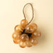Indaba peach bubble bunch ornament with rounded glass droplets, dark metal fittings and a natural twine hanging loop