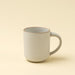Indaba Rowe ivory stoneware mug with a speckled glaze, rounded handle and contrasting brown rim
