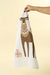 Cream flour sack tea towel hanging from its loop, displaying a stag and holiday gift illustration